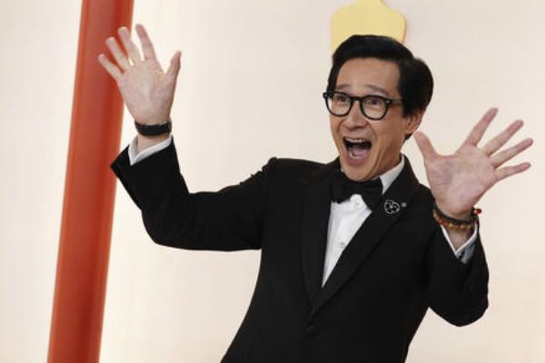 Ke Huy Quan arrives at the Oscars on Sunday, March 12, 2023, at the Dolby Theatre in Los Angeles. (Photo by Jordan Strauss/Invision/AP)