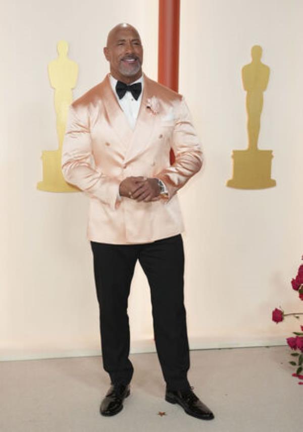 Dwayne Johnson arrives at the Oscars on Sunday, March 12, 2023, at the Dolby Theatre in Los Angeles. (Photo by Jordan Strauss/Invision/AP)