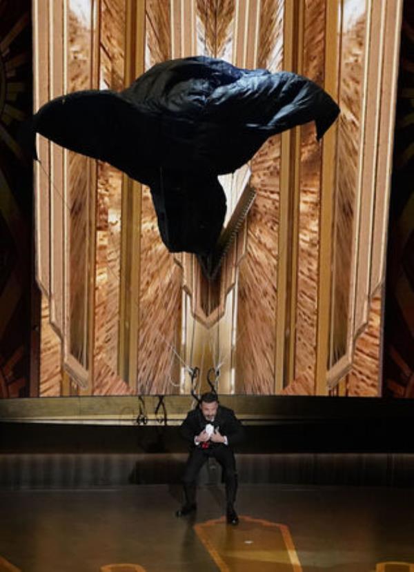 Host Jimmy Kimmel drops o<em></em>nto stage by parachute at the Oscars on Sunday, March 12, 2023, at the Dolby Theatre in Los Angeles. (AP Photo/Chris Pizzello)