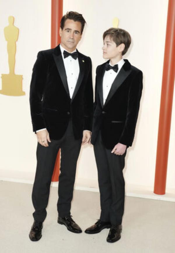 Colin Farrell, left, and Henry Tadeusz Farrell arrive at the Oscars on Sunday, March 12, 2023, at the Dolby Theatre in Los Angeles. (Photo by Jordan Strauss/Invision/AP)