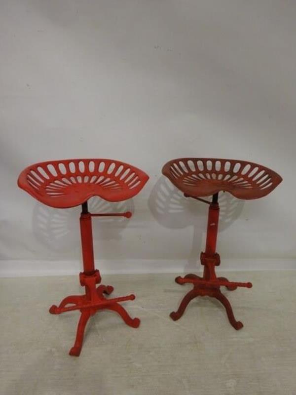  A pair of adjustable me<em></em>tal tractor stools at Lynes and Lynes,